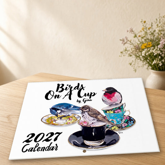 2027 Birds On A Cup Fold-Out Wall Calendar by Gina on wooden table