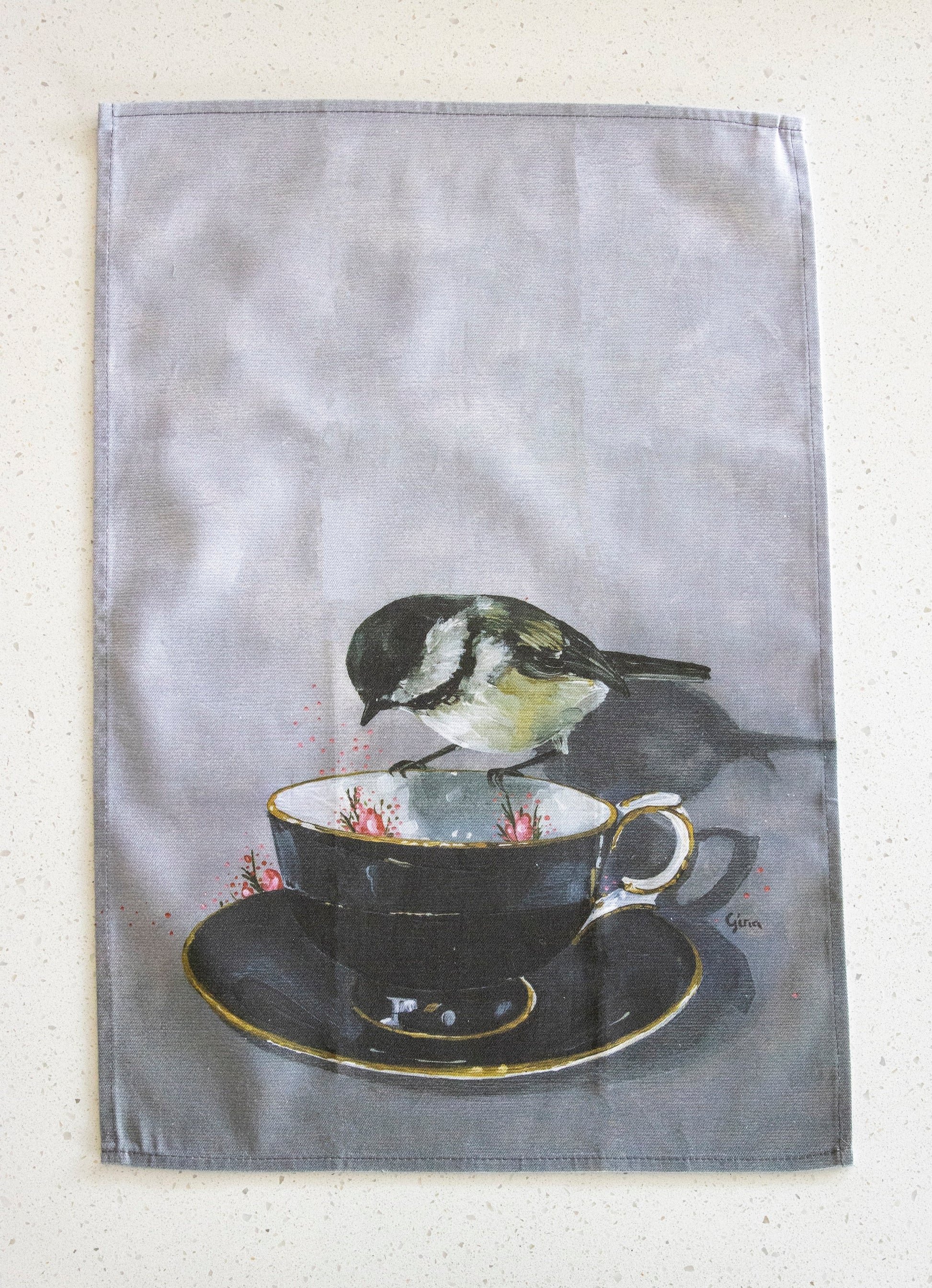 Chickadee perched on a black tea cup — bird art tea towel by Birds on a Cup