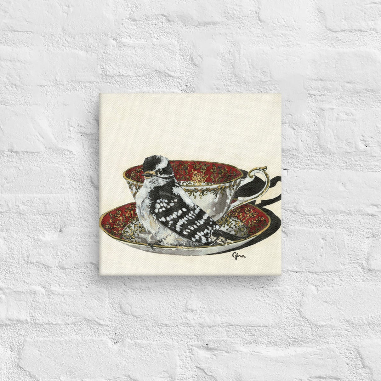 Proud Downy Woodpecker on a ruby and gold teacup — 10x10 canvas print by Birds on a Cup
